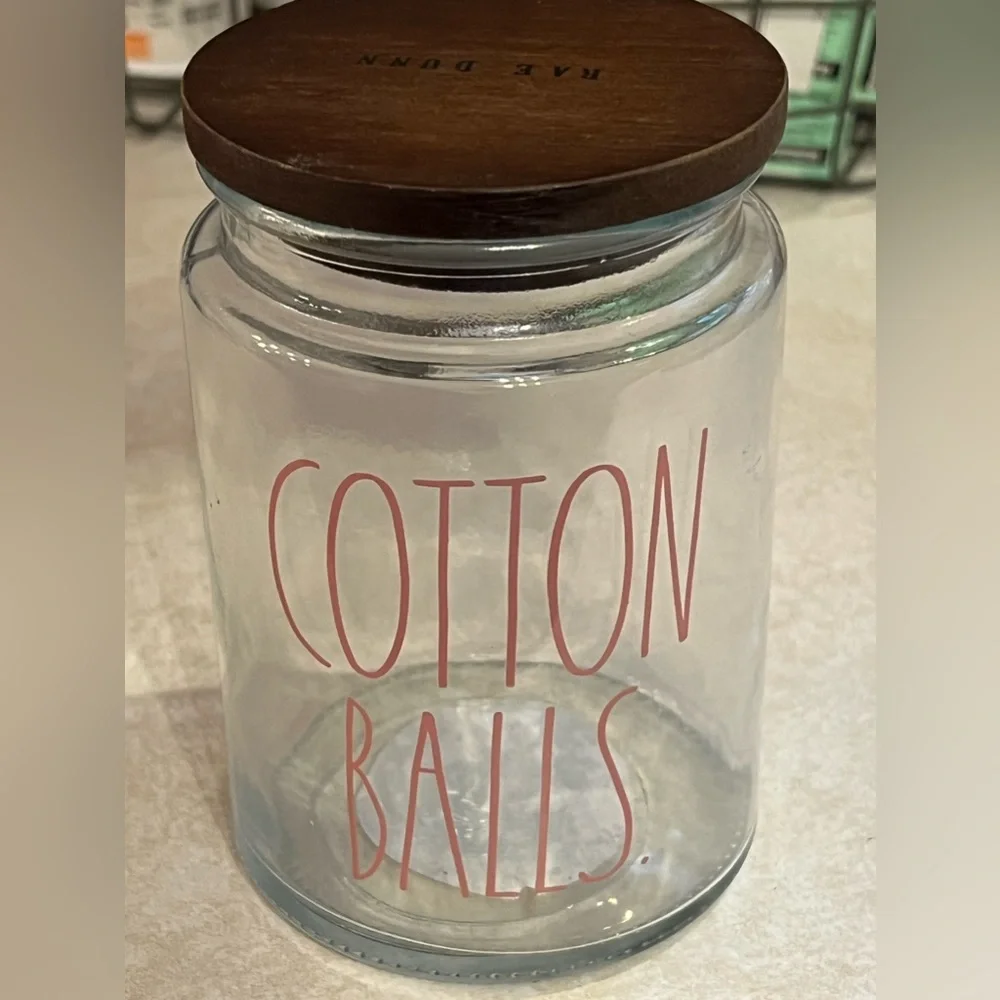 Rae Dunn glass‎ with wood lid container with red lettering “COTTON BALLS”